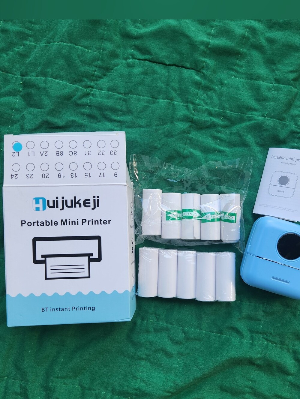 Huijukeji Portable Mini Printer in Light Blue with White Paper Rolls